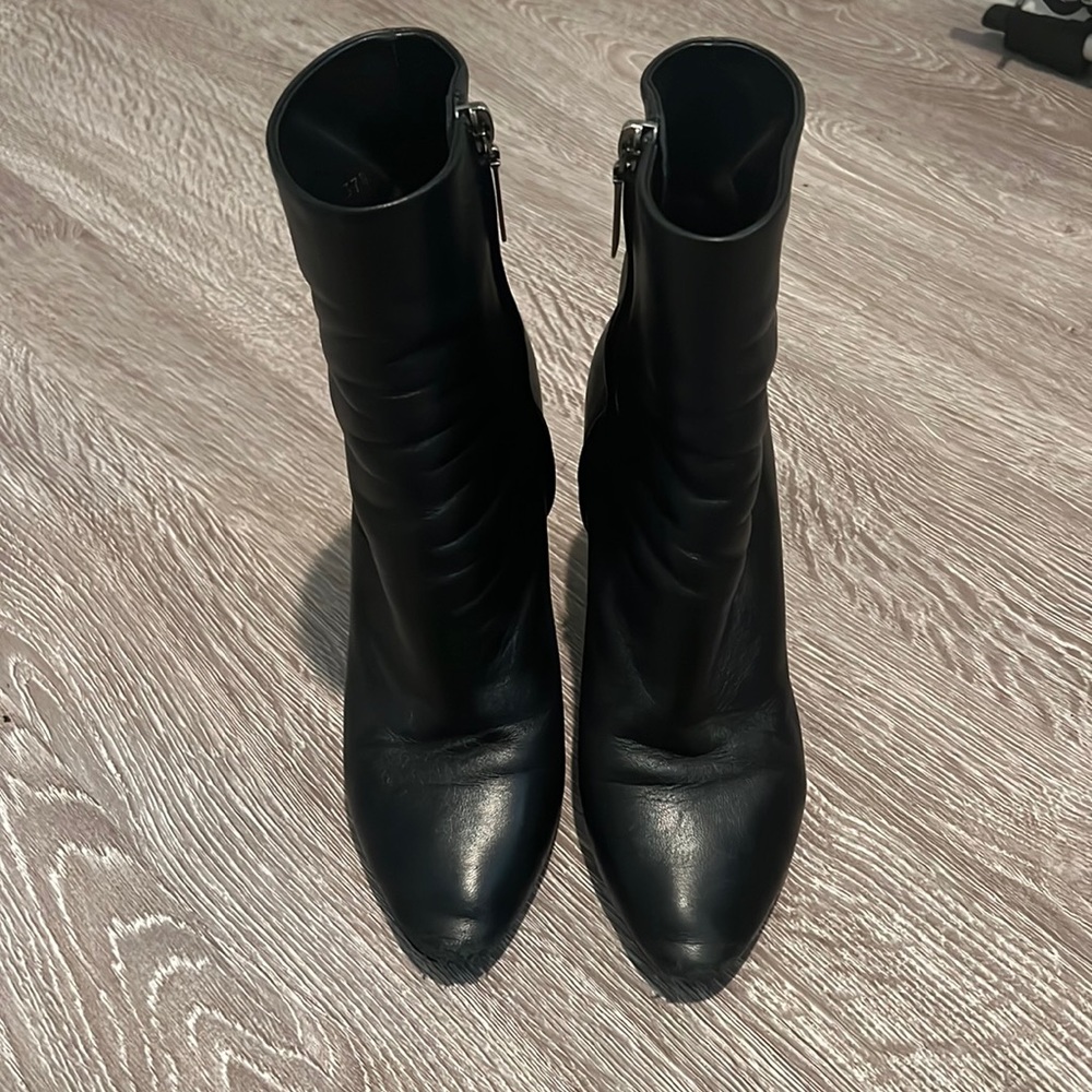 Saint Laurent Lou black heel boots.
